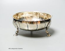 A Victorian repousse silver bowl, on three hoof feet, London, 1871, diameter 12.6cm, 6oz.