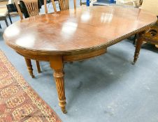 An Edwardian mahogany oval extending dining table, length 180cm extended with one spare leaf, width