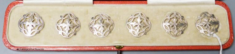 An Edwardian cased set of six pierced silver dress buttons, John Tiley, London, 1902, 25mm.