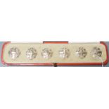 An Edwardian cased set of six pierced silver dress buttons, John Tiley, London, 1902, 25mm.