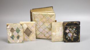 Three Victorian mother of pearl card cases, a papier mache card case and a mother of pearl bound