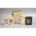 Three Victorian mother of pearl card cases, a papier mache card case and a mother of pearl bound