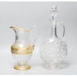 A Baccarat gilt and cut glass jug and a strawberry cut glass decanter and stopper, tallest 38 cm