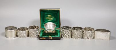 A set of four Victorian embossed silver napkin rings, A & J. Zimmerman, Birmingham, 1889 and four