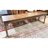 An 18th century style oak low bench seat, length 140cm, depth 32cm, height 42cm