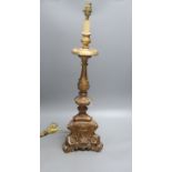 A late 19th century Italian Baroque style giltwood and gesso candlestand,(converted to