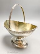 A George III silver boat shaped pedestal sugar basket, James Young, London, 1790, width 17.3cm, 10.