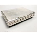 A 20th century Cartier sterling mounted rectangular cigarette box, on bun feet,signed on base, 13,