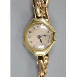 A lady's 18ct gold manual wind wrist watch(a.f.), on a 15ct expanding bracelet,gross weight 24.2