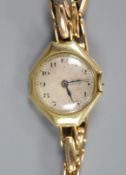 A lady's 18ct gold manual wind wrist watch(a.f.), on a 15ct expanding bracelet,gross weight 24.2