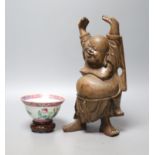 A Chinese Straits famille rose ‘dragon’ bowl, 11cm, and a carved wood figure of a Budai, 28cm