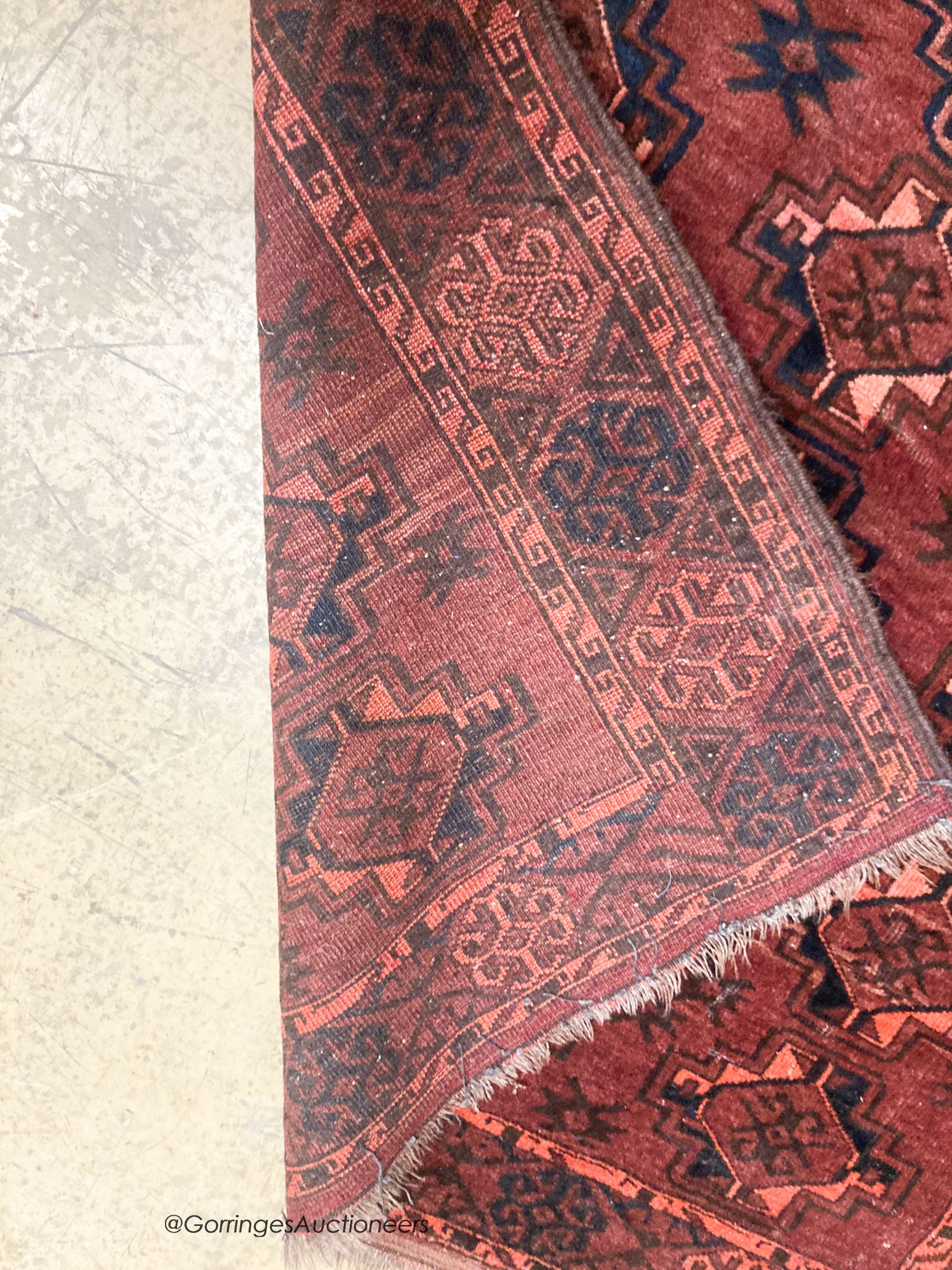 A Bokhara burgundy ground rug, 190 x 105cm - Image 5 of 5