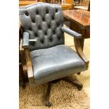 A pair of reproduction beech buttoned blue leather swivel desk chairs, width 60cm, depth 55cm,