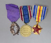 Three medals, including a Polish commemorative war medal (1918-1921), a Franco-Canadian Order of