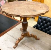 An early 20th century circular oak tripod table, W.67cm H.69cm