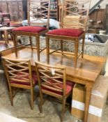 A Swedish walnut and beech dining suite comprising rectangular table. 200cm extended (two spare