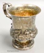 An early Victorian silver vase shaped christening mug, embossed with leaves, Brown & Somersall,