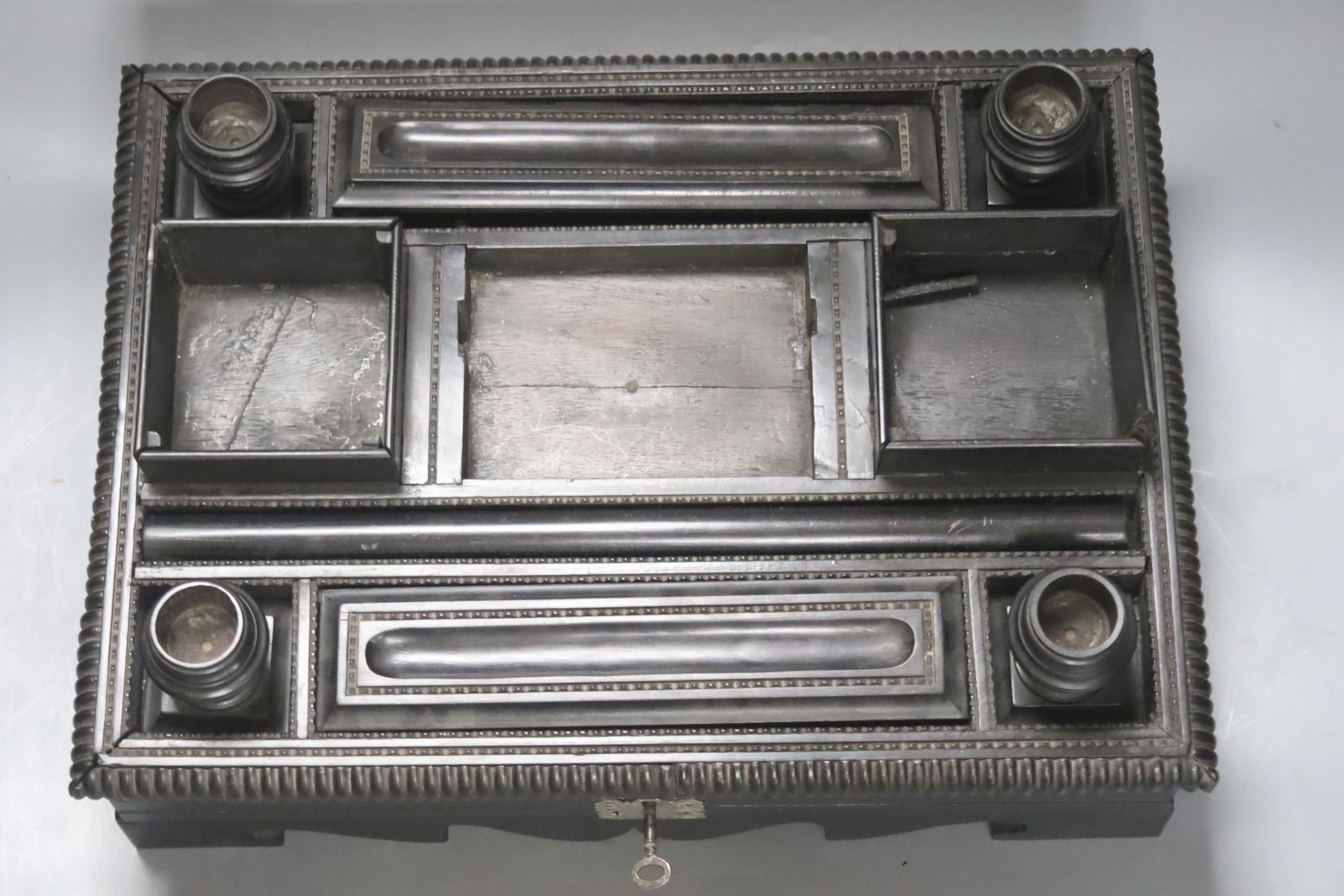 A 19th century Indo-Colonnial ebony desk stand, single drawer with engraved white metal escutcheon, - Image 2 of 2