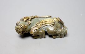 A Chinese celadon jade and gilt metal mounted figure of a Pixiu, 12cm long