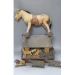 An early 20th century Steiff pull-along horse on wheels, boot button eyes and wood wool filling,