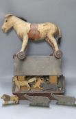 An early 20th century Steiff pull-along horse on wheels, boot button eyes and wood wool filling,