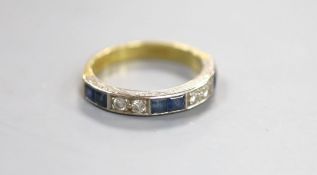 A modern 18ct gold and channel set six stone sapphire and four stone diamond half hoop ring, size