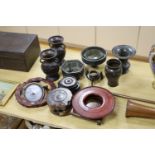 A group of Japanese bronze vases and sundry hardwood stands