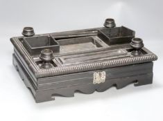 A 19th century Indo-Colonnial ebony desk stand, single drawer with engraved white metal escutcheon,