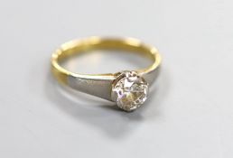 A yellow metal and solitaire diamond ring, the stone weighing approx. 0.75-0.80ct, size K, gross