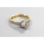 A yellow metal and solitaire diamond ring, the stone weighing approx. 0.75-0.80ct, size K, gross
