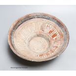 An Islamic bowl with kufic script, diameter 24cm