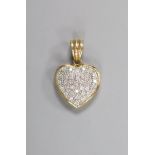 A modern 9k and pave set diamond chip heart pendant, overall 23mm, gross weight 3.3 grams.