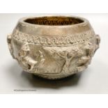 An Indian embossed white metal bowl, decorated with deities, height 8.5cm, 9oz.