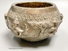 An Indian embossed white metal bowl, decorated with deities, height 8.5cm, 9oz.