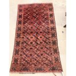 A Bokhara burgundy ground rug, 190 x 105cm