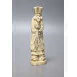 A Japanese walrus ivory figure of an immortal, early 20th century, 13cm