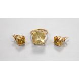 A yellow metal and citrine set dress ring, size K and a pair of similar ear studs, gross weight 10