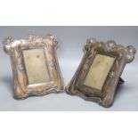 A pair of Art Nouveau embossed copper photograph frames, height 25cm