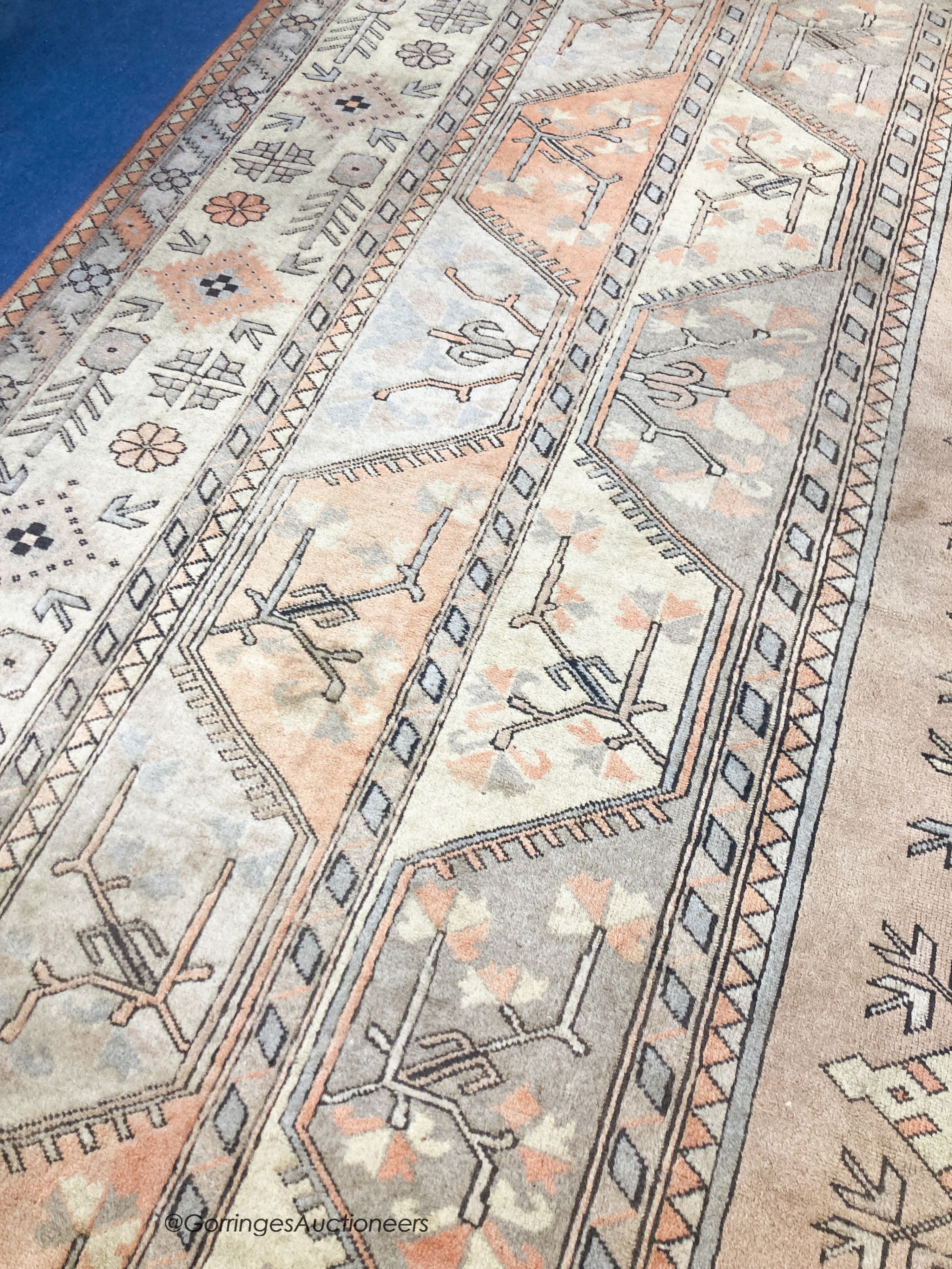 A large Caucasian Turkish design fawn ground carpet, 420 x 300cm - Image 3 of 7