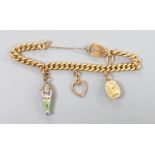 An Edwardian 15ct gold, curb link charm bracelets, hung with three assorted charms, gross weight