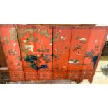 A Chinese red lacquered six fold screen, each panel W.41cm H.184cm