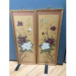 A pair of Chinese fabric panels decorated with chrysanthemums inscription and red sea, 74 x 25cm,