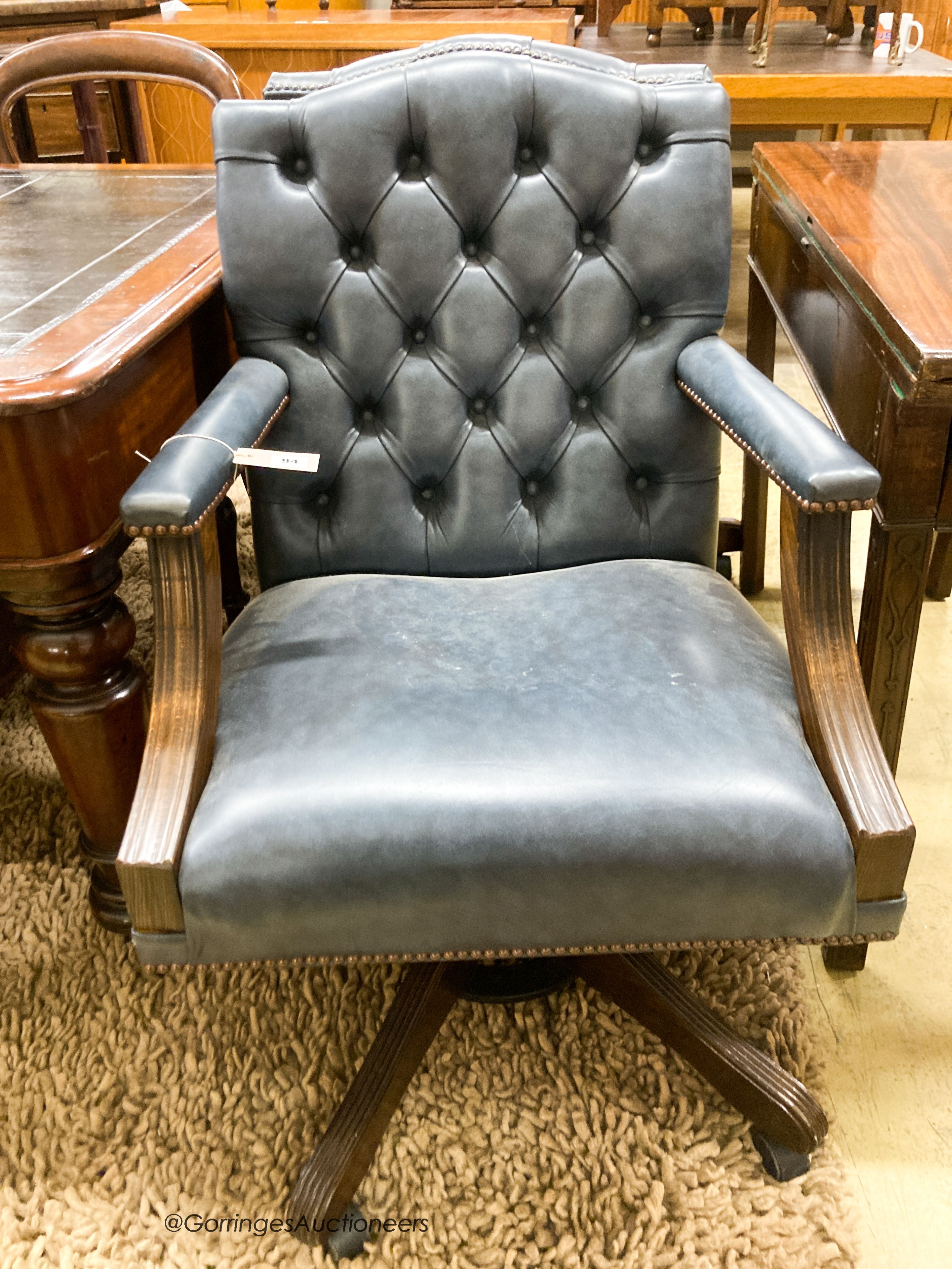 A pair of reproduction beech buttoned blue leather swivel desk chairs, width 60cm, depth 55cm, - Image 2 of 3