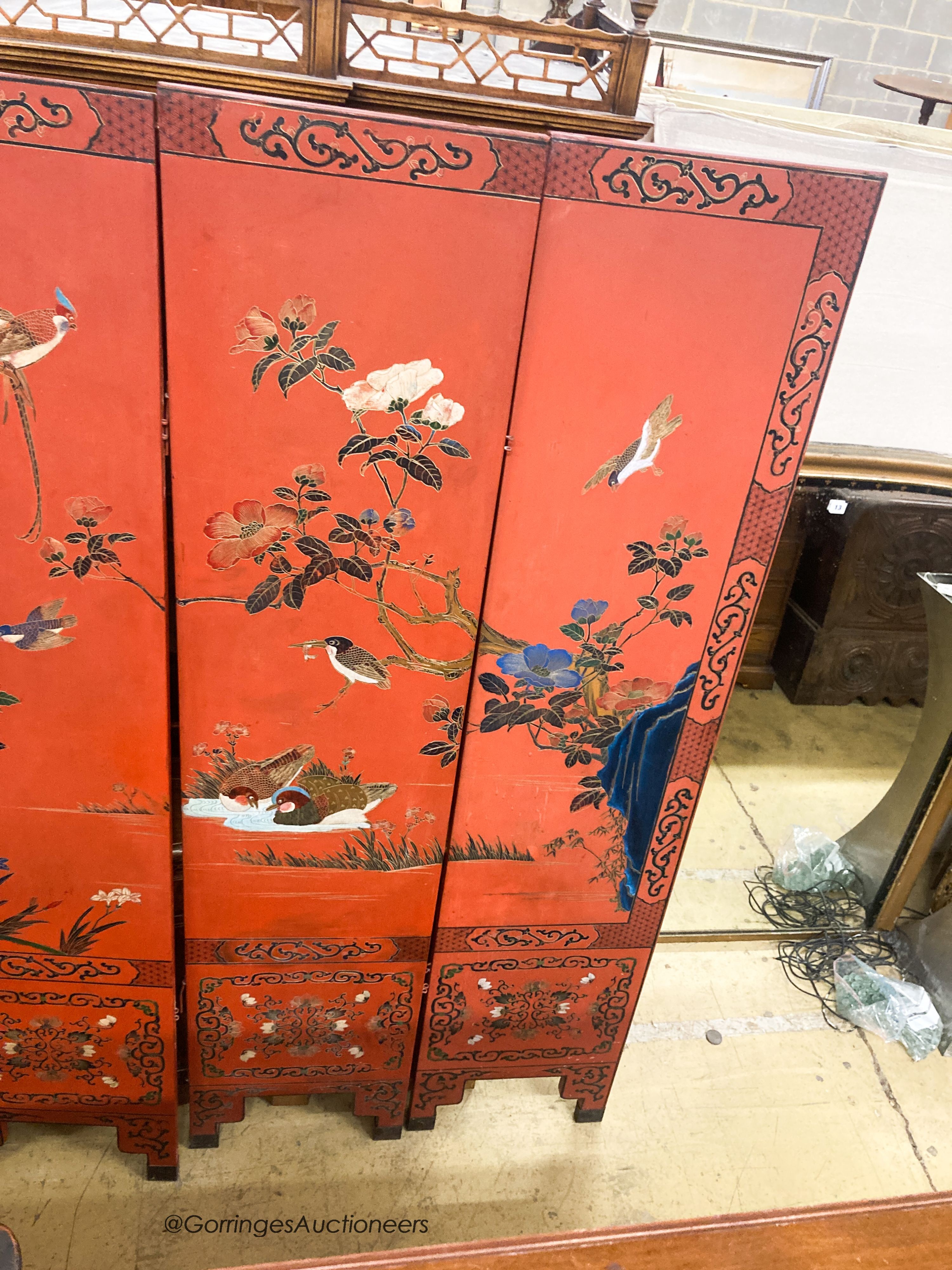 A Chinese red lacquered six fold screen, each panel W.41cm H.184cm - Image 4 of 4