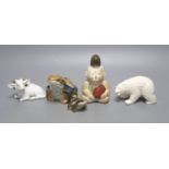 A Japanese Hirado porcelain figure of a polar bear, a Japanese porcelain figure of a ram, two
