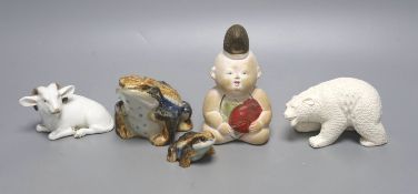 A Japanese Hirado porcelain figure of a polar bear, a Japanese porcelain figure of a ram, two