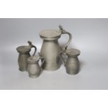 Four 18th century pewter baluster measures, tallest 20cm