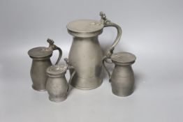 Four 18th century pewter baluster measures, tallest 20cm