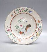 An 18th century Chinese export porcelain ‘tobacco leaf’ plate, painted in famille rose enamels,