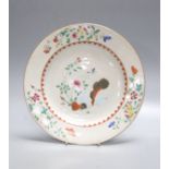 An 18th century Chinese export porcelain ‘tobacco leaf’ plate, painted in famille rose enamels,